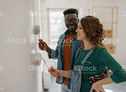 Young  couple painting walls